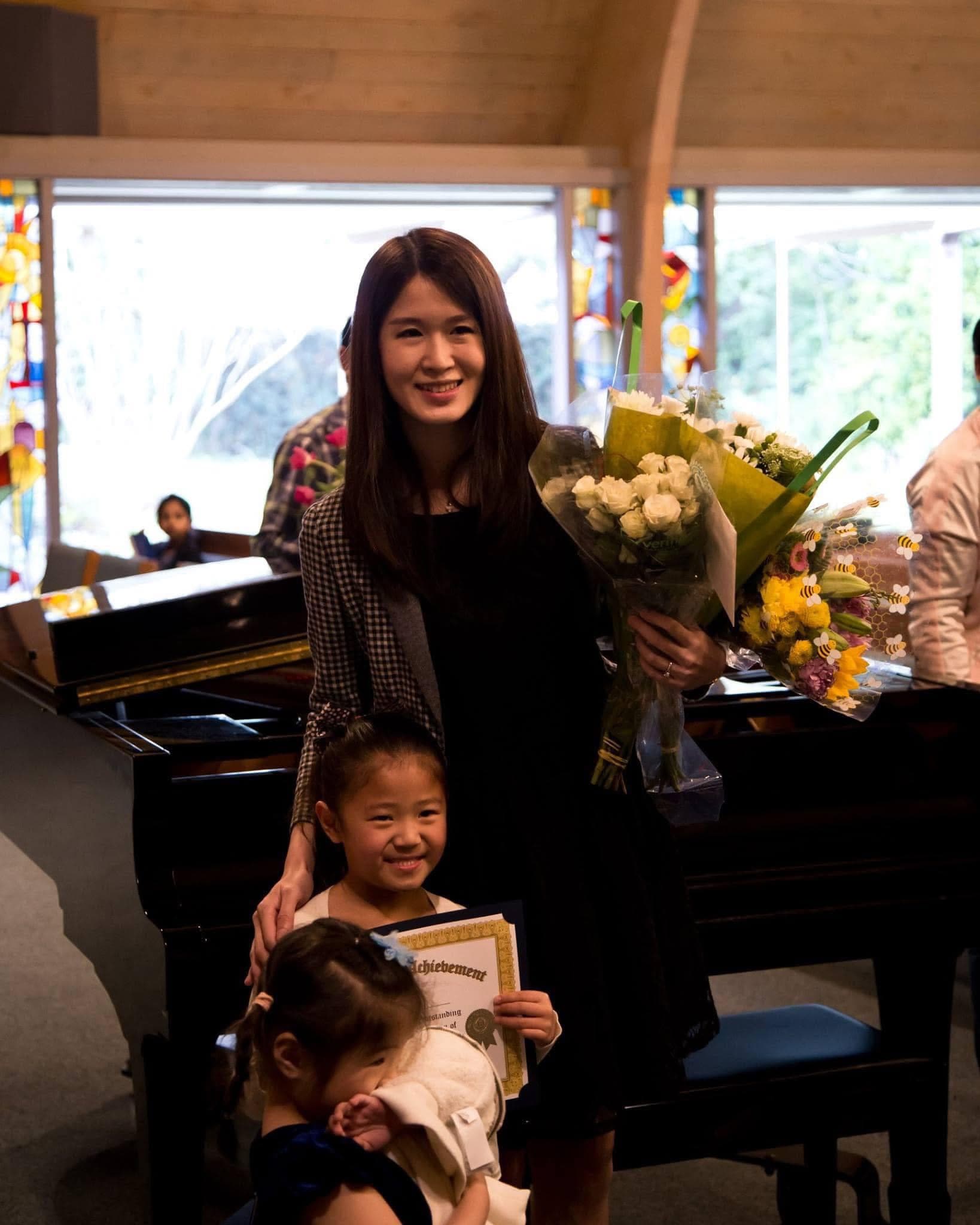 Eve with student — certificate