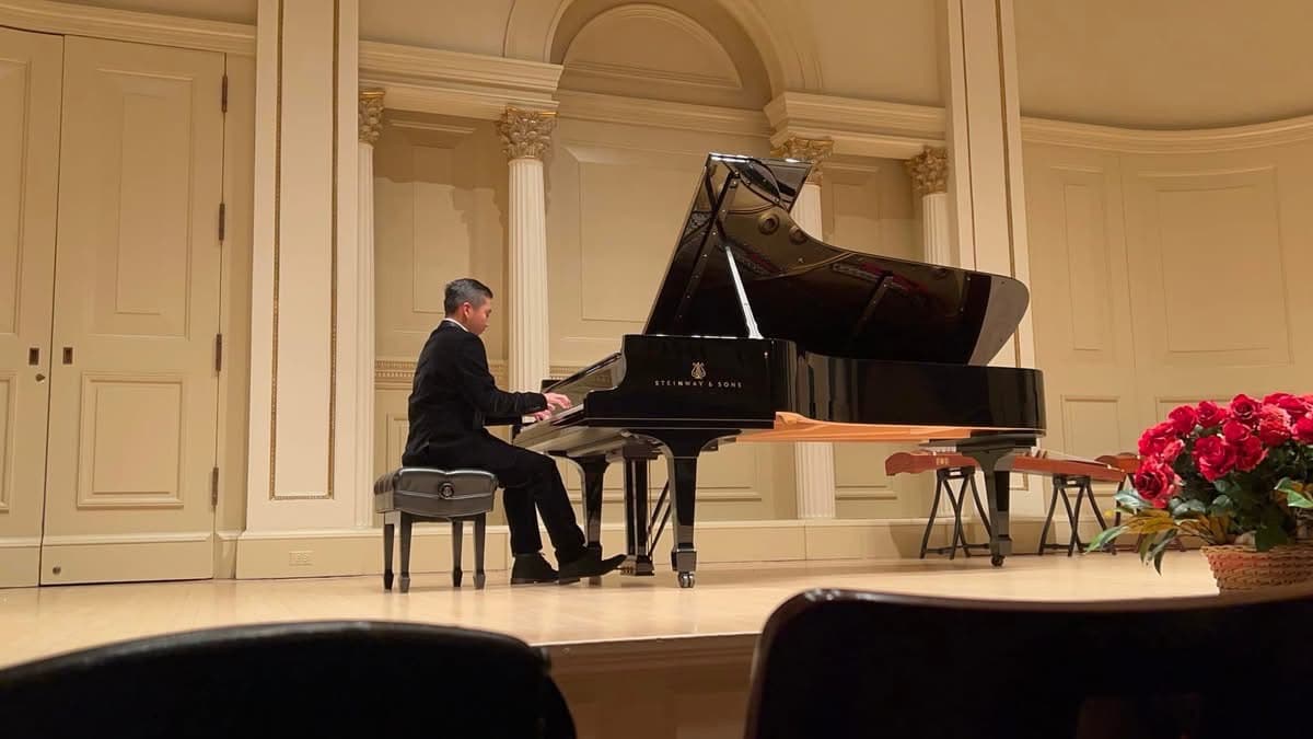 A student of Eve Chen performing on a Steinway grand piano at Carnegie Hall, New York